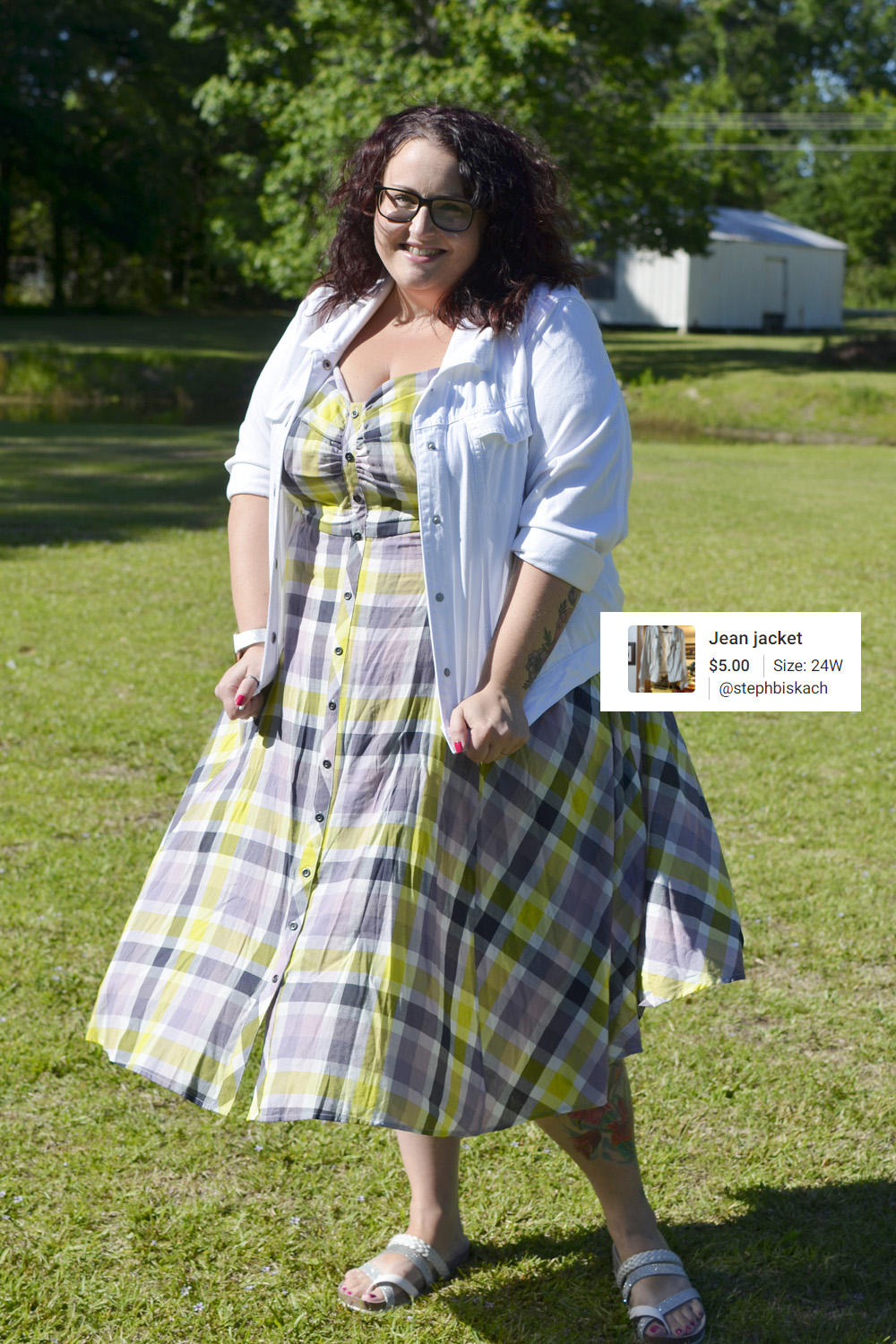 Maranda, a plus size woman, models Outfit of the Day with a white Lane Bryant denim jacket over plaid Torrid dress.