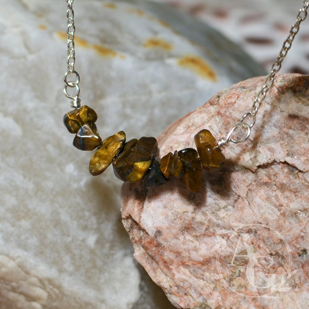 Tiger's eye bead chips on a bar necklace from Awaken Gemini on Etsy.