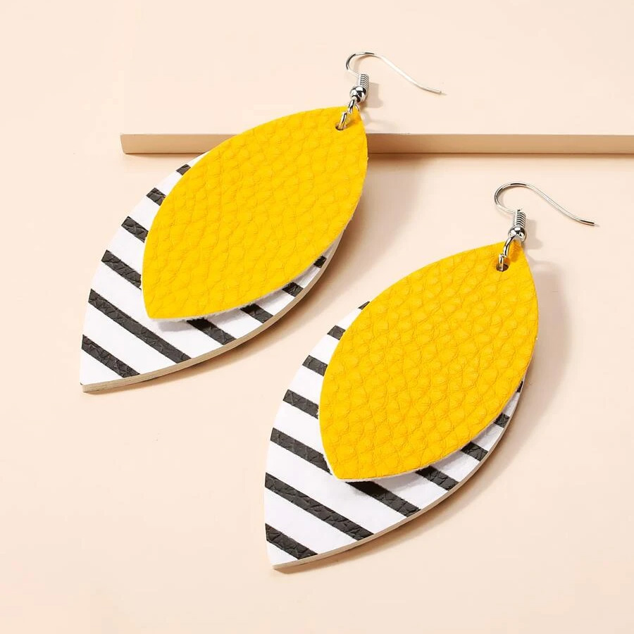 Product photo of Shein's yellow, black and white layered dangle earrings.