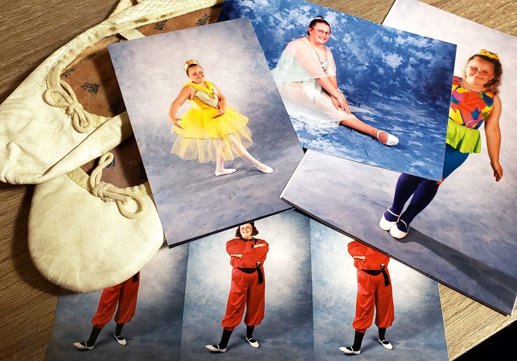 A collage of printed portrait photographs of Maranda at four different ages - from child to teenager - dressed in dance recital costumes. An old pair of her ballet slippers rests to the side.