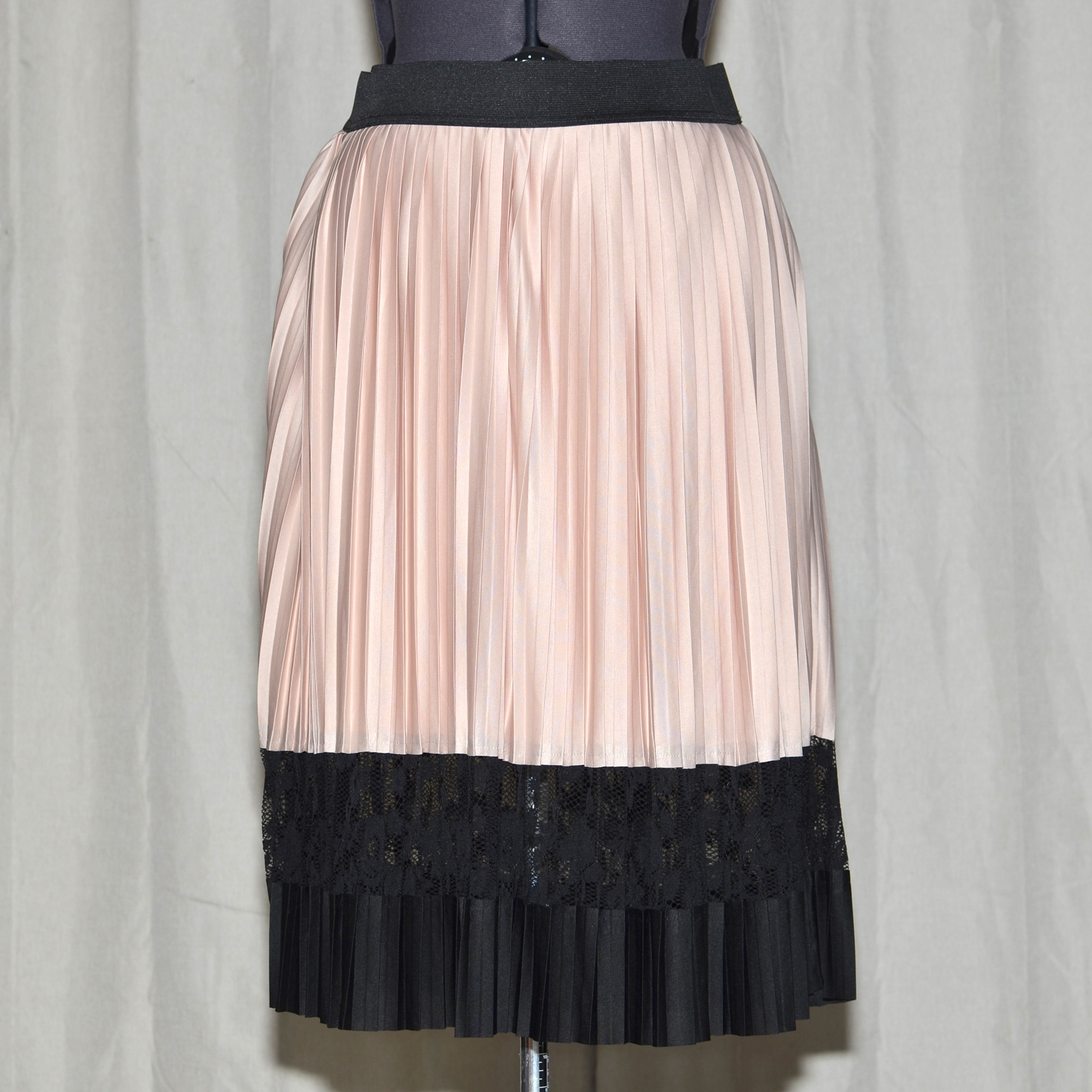 Lane Bryant plus size circle / skater skirt with thin accordion pleats in blush pink, with contrasting black lace panel and waistband.