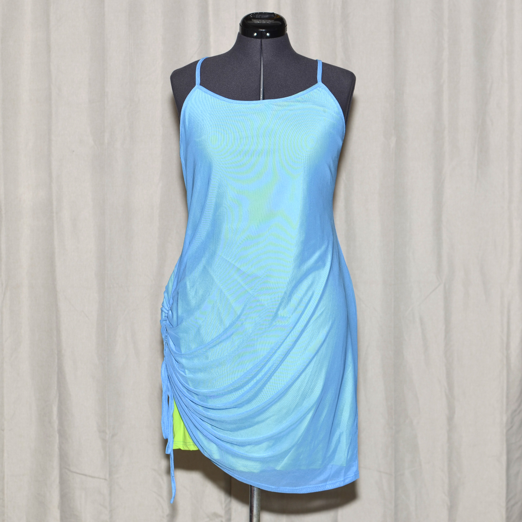 Plus size layered slinky mini dress by Shein. Top layer is vibrant blue mesh, drawn up on one side to expose the neon lime green lining underneath.